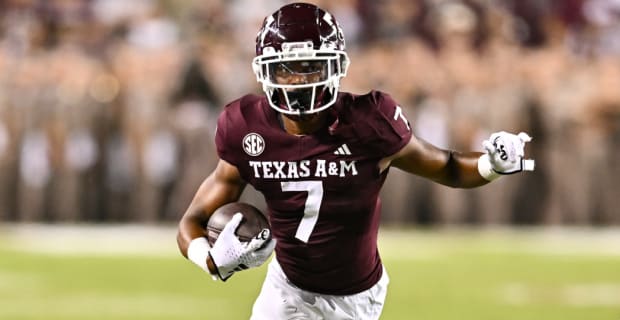 Texas A&M Aggies wide receiver Moose Muhammad catches a pass during a college football game in the SEC.